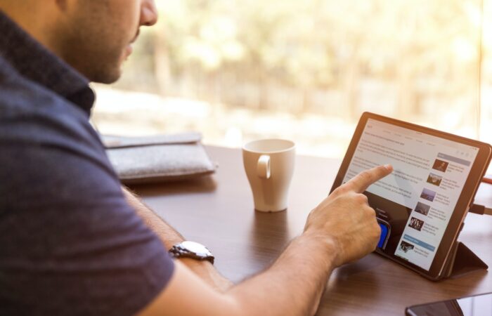 man holding tablet computer